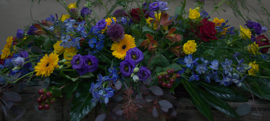 Blue , Red and Yellow Casket - Quality Flowers from Ann's Flowers - Just £165! Shop now at Ann's Flowers